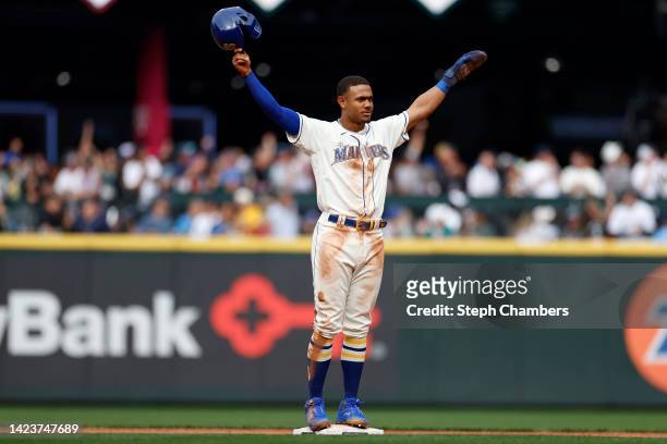 Julio Rodriguez of the Seattle Mariners is acknowledged after stealing his 25th base and recording his 25th home run in a single rookie season during...