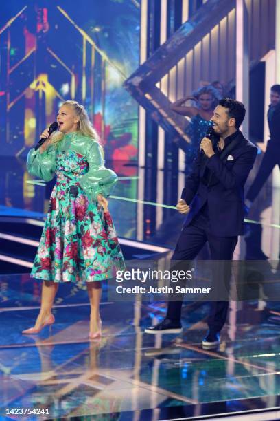 Barbara Schoeneberger an Giovanni Zarrella perform on stage during the German Television Award at MMC Studios on September 14, 2022 in Cologne,...