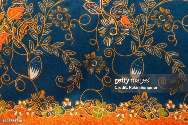 full frame thai silk traditional motif textile and texture background. - flores indonesia - fotografias e filmes do acervo