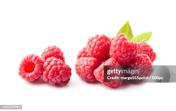 close-up of raspberries against white background - framboises photos et images de collection