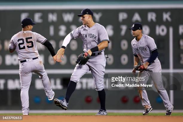 Aaron Judge of the New York Yankees celebrates with Gleyber Torres after the Yankees defeat the Boston Red Sox 5-3 at Fenway Park on September 14,...