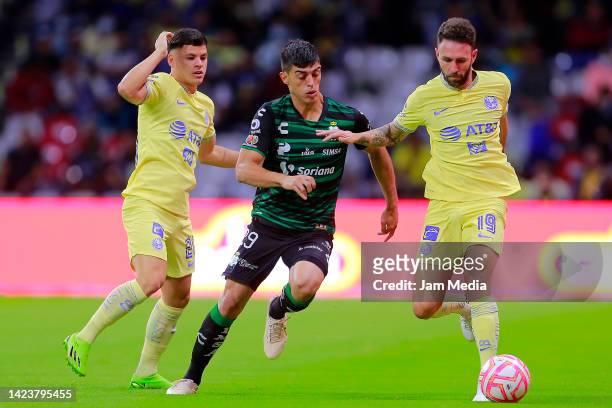 Richard Sanchez fights for the ball with Miguel Layun of America during the 5th round match between America and Santos Laguna as part of the Torneo...