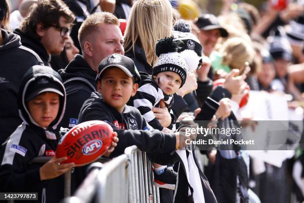 Magpies fans look on during a Collingwood Magpies AFL training session at Olympic Park Oval on September 15, 2022 in Melbourne, Australia.