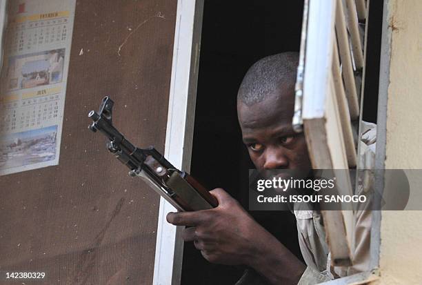 Malian soldier looks as junta leader captain Amadou Sanogo speaks on April 3, 2012 at the Kati military camp near Bamako. Mali's under-fire junta on...