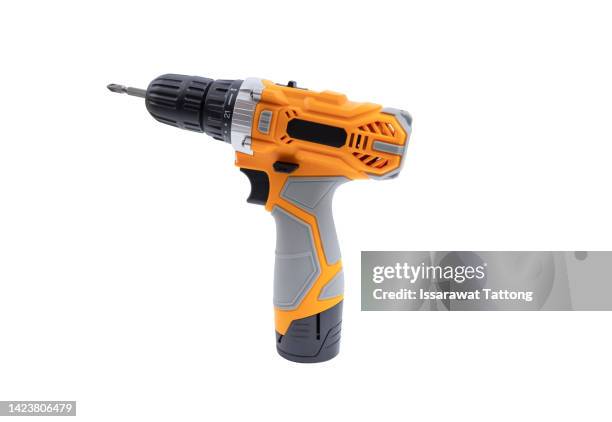 orange screwdriver on a white background - boor stockfoto's en -beelden