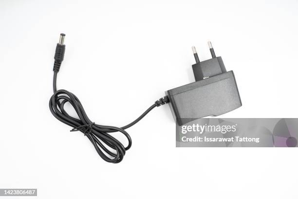 ac adapter isolated on white background - chargeur de batterie photos et images de collection