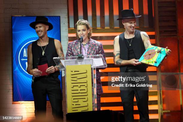 Phil Hanseroth, Brandi Carlile and Tim Hanseroth accept an award onstage for the 21st Annual Americana Honors & Awards at Ryman Auditorium on...