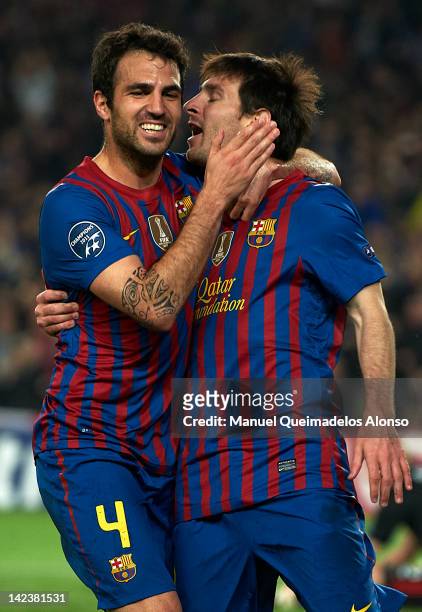 Lionel Messi of Barcelona celebrates after scoring the first goal with his teammate Cesc Fabregas during the UEFA Champions League quarter-final...