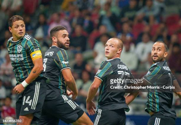 Javier Hernandez, Derrick Williams, Chase Gasper and Victor Vazquez of the Los Angeles Galaxy turn to watch the ball sail past against the Vancouver...