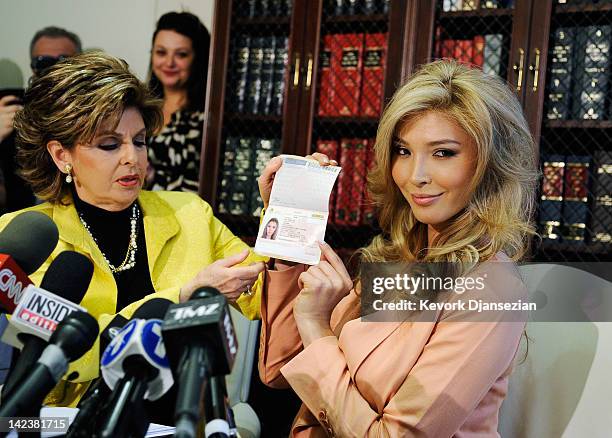 Jenna Talackova , a would be Miss Universe contestant, shows her Canadian passport, as a proof that she is a female, during a news conference with...