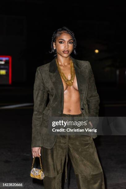 Lori Harvey wearing khaki blazer and pants, micro bag outside Tom Ford on September 14, 2022 in New York City.