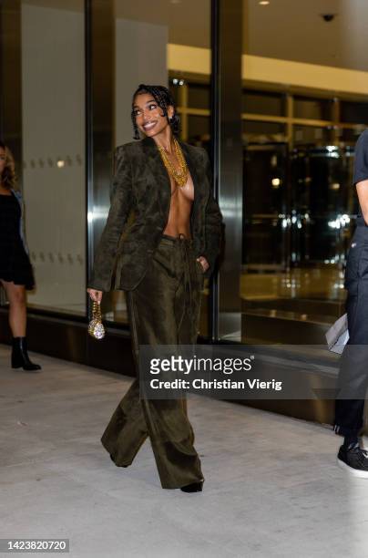 Lori Harvey wearing khaki blazer and pants, micro bag outside Tom Ford on September 14, 2022 in New York City.