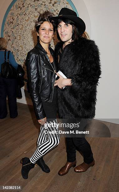 Lliana Bird and Noel Fielding attend a private view of the Damien Hirst retrospective exhibition at the Tate Modern on April 3, 2012 in London,...