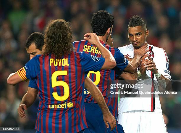 Kevin-Prince Boateng of AC Milan argues with Daniel Alves and Sergio Busquets of FC Barcelona during the UEFA Champions League quarter-final second...
