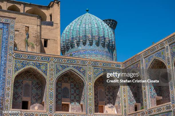 sher-dor madrasah at registan square in samarkand, uzbekistan - uzbekistan stock pictures, royalty-free photos & images