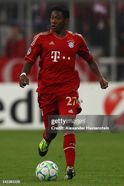 David Alaba of FC Bayern Muenchen runs with the ball during the UEFA Champions League quarter final second leg match between FC Bayern Muenchen and...