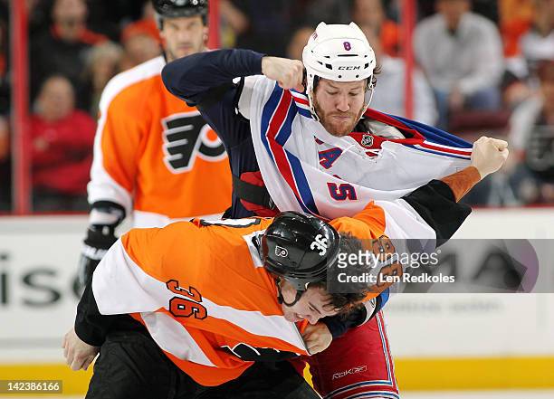 Zac Rinaldo of the Philadelphia Flyers and Brandon Prust of the New York Rangers fight in the first period on April 3, 2012 at the Wells Fargo Center...