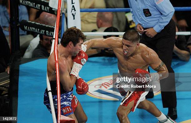 Fernando Vargas lands a right hook against Oscar De La Hoya during their world super welterweight /Jr. Middleweight championship fight at the...