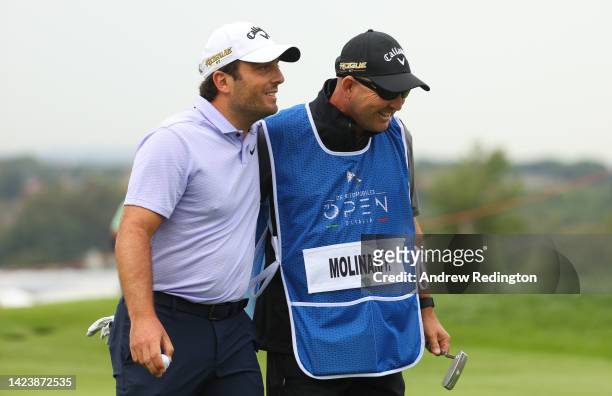 Francesco Molinari of Italy shares a joke with his caddy Pello Iguaran on the 12th hole on Day One of the DS Automobiles Italian Open 2022 at Marco...