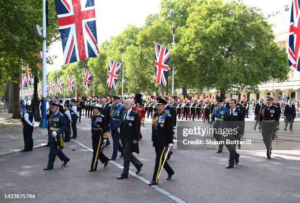 King Charles III, Princess Anne, Princess Royal, Prince Andrew, Duke of York, Prince Edward, Earl of Wessex walk behind the coffin along The Mall...