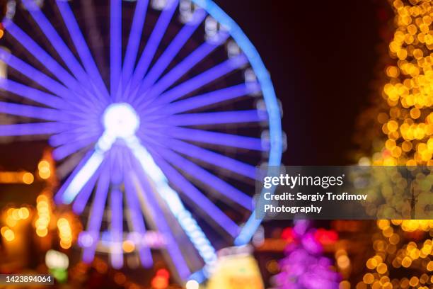 defocused christmas lights at night kyiv - big wheel stock pictures, royalty-free photos & images