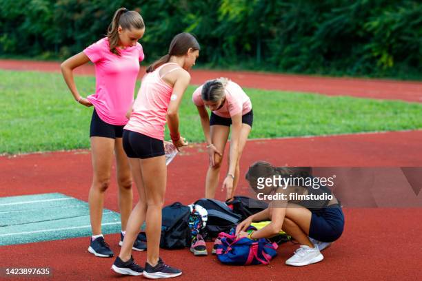 female athletes refreshing after hard workout - childhood diabetes stock pictures, royalty-free photos & images
