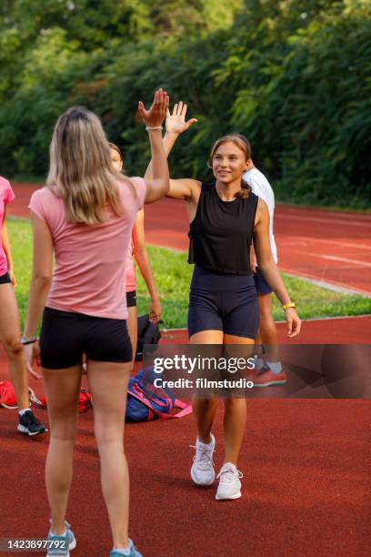 the coach greets the athletes who come to stadium - childhood diabetes stock pictures, royalty-free photos & images