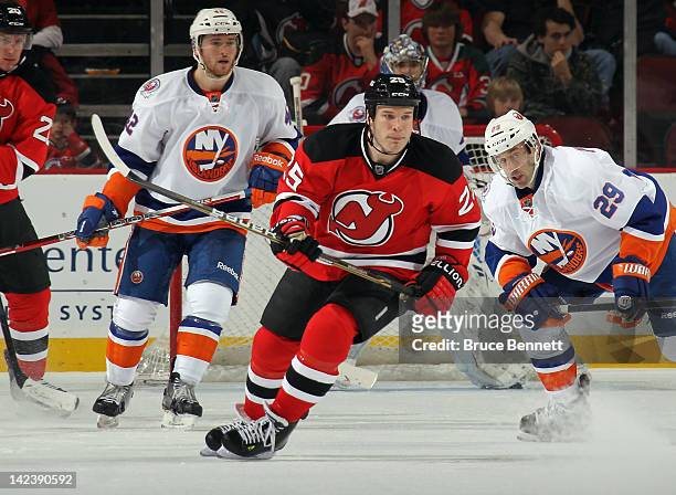Cam Janssen of the New Jersey Devils skates against the New York Islanders at the Prudential Center on April 3, 2012 in Newark, New Jersey. The...