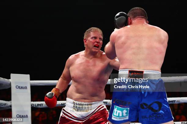 Ben Hannant punches Paul Gallen during the bout at Nissan Arena on September 15, 2022 in Brisbane, Australia.