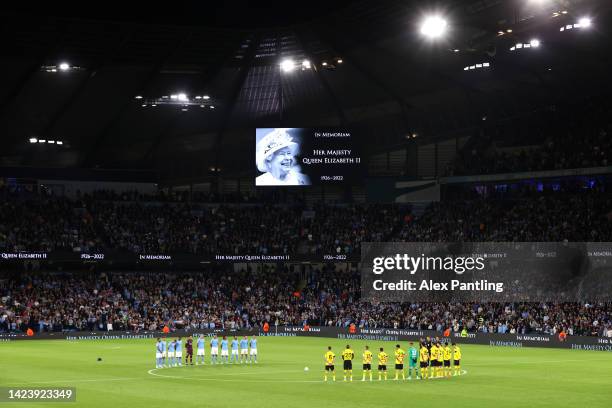 Players and spectators observe a minute silence, as LED boards around the stadium pay tribute to Her Majesty Queen Elizabeth II, who died away at...