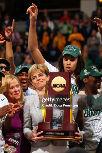 Head coach Kim Mulkey and Brittney Griner of the Baylor Bears celebrate with the National Championship trophy after they won 80-61 against the Notre...