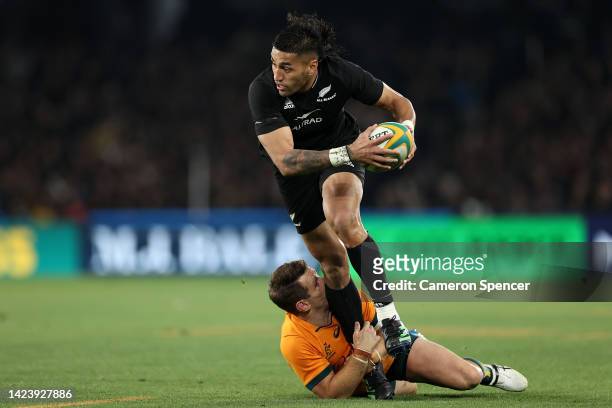Rieko Ioane of the All Blacks is tackled by Bernard Foley of the Wallabies during The Rugby Championship & Bledisloe Cup match between the Australia...