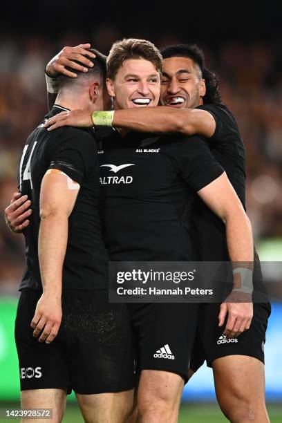 Will Jordan of the All Blacks celebrates after scoring a try with Beauden Barrett and Rieko Ioane of the All Blacks during The Rugby Championship &...