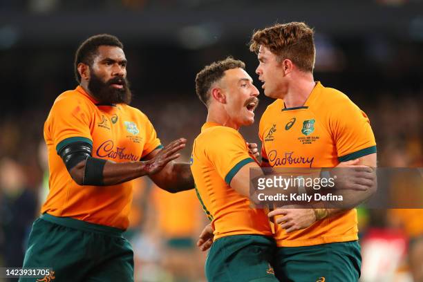 Andrew Kellaway of the Wallabies celebrates scoring a try with Nic White and Marika Koroibete of the Wallabies during The Rugby Championship &...
