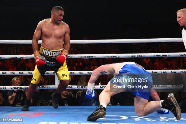 Justin Hodges knocks down Paul Gallen during their bout at Nissan Arena on September 15, 2022 in Brisbane, Australia.