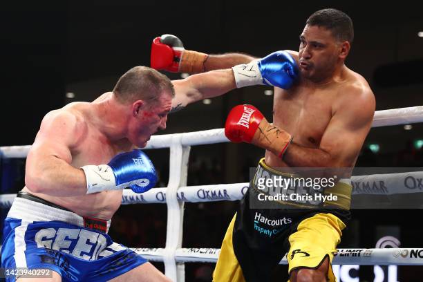 Paul Gallen and Justin Hodges exchange punches during their bout at Nissan Arena on September 15, 2022 in Brisbane, Australia.