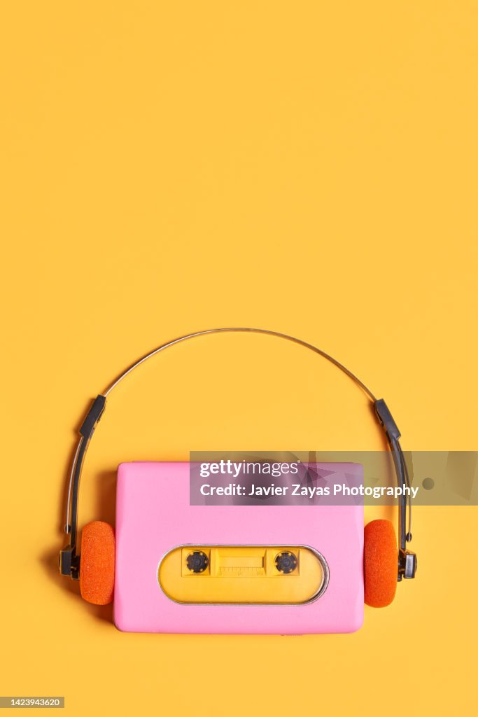 Pink Portable Audio Cassette Player On Yellow Background