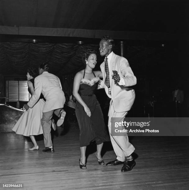 Black Americans take to the dancefloor to show off their 'Swing' dance moves at the Savoy Ballroom in Harlem, New York City, New York, United States,...