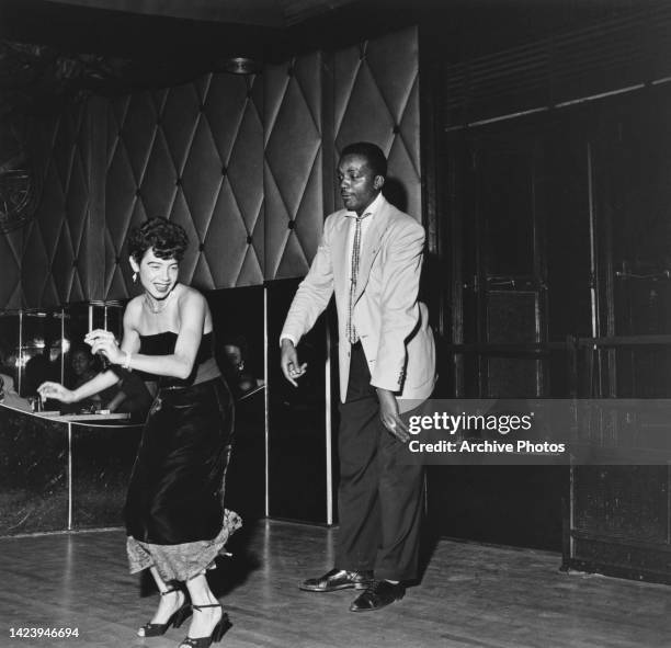 Black Americans take to the dancefloor to show off their 'Swing' dance moves at the Savoy Ballroom in Harlem, New York City, New York, United States,...