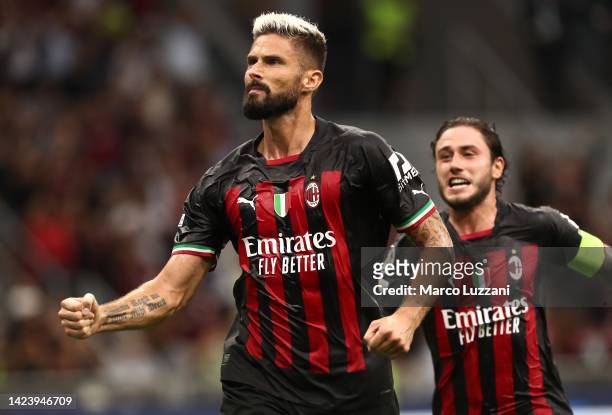 Olivier Giroud of AC Milan celebrates after scoring the opening goal during the UEFA Champions League group E match between AC Milan and Dinamo...