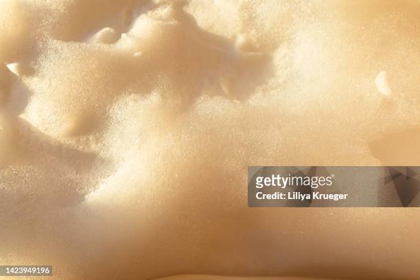 abstract background with foam in sunset light. - duschgel nobody stock-fotos und bilder