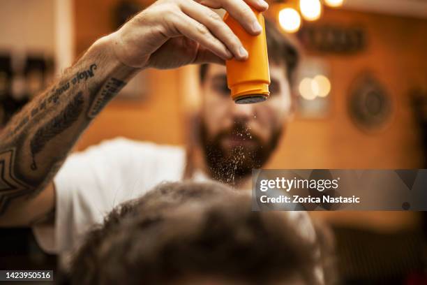 barber throwing talcum powder on the hair - ruffled hair stock pictures, royalty-free photos & images