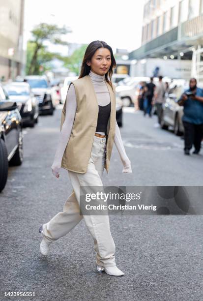 Yan Yan Chan wearing beige vest outside Cos on September 13, 2022 in New York City.