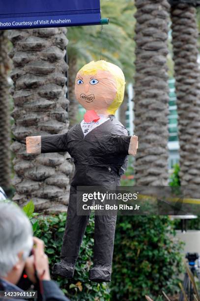 Piñata of U.S. Republican Presidential candidate Donald Trump hangs near the entrance to Anaheim Convention Center as U.S. Republican Presidential...