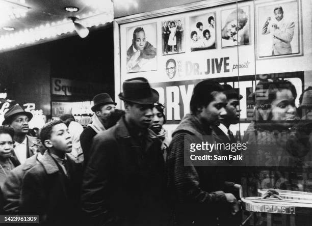 An unspecified group of Black people waiting in at the Apollo Theater in Harlem neighbourhood of Manhattan, New York City, New York, circa 1960. The...