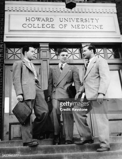 American students Blair Hunt, Paul Guth , and Arvine N Bradford after Guth became the first white student admitted to the Alpha Chapter of the Chi...
