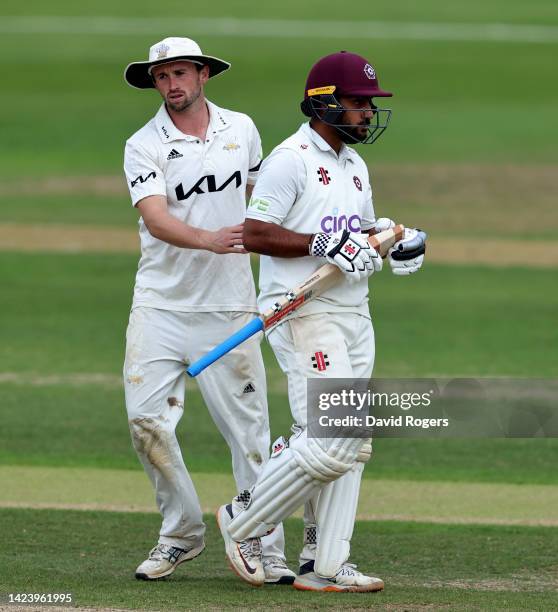 Saif Zaib of Northamptonshire, receives commiserations from Surrey's Cameron Steel, after being dismissed for 124 runs during the LV= Insurance...