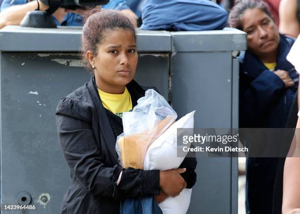 Migrants from Central and South America wait near the residence of US Vice President Kamala Harris after being dropped off on September 15, 2022 in...