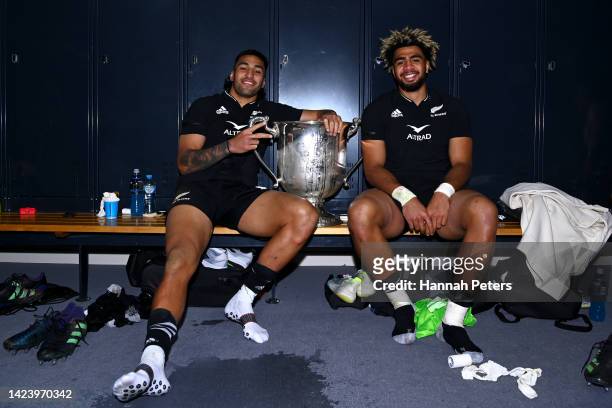 Rieko Ioane and Hoskins Sotutu of the All Blacks celebrate with the Bledisloe Cup in the changing room after winning The Rugby Championship &...