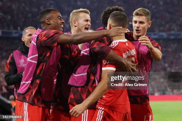 Lucas Hernandez of Bayern Muenchen celebrates their team's first goal with teammates during the UEFA Champions League group C match between FC Bayern...